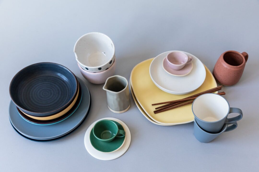 ceramic dinnerware on blue surface
