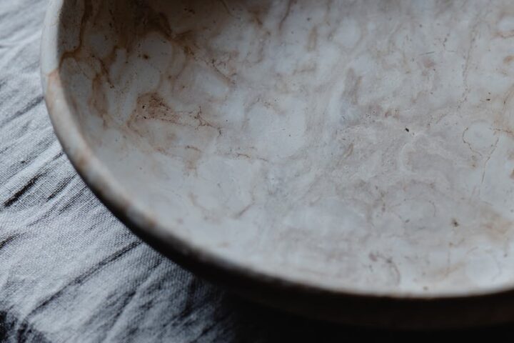 ceramic plate on gray textile